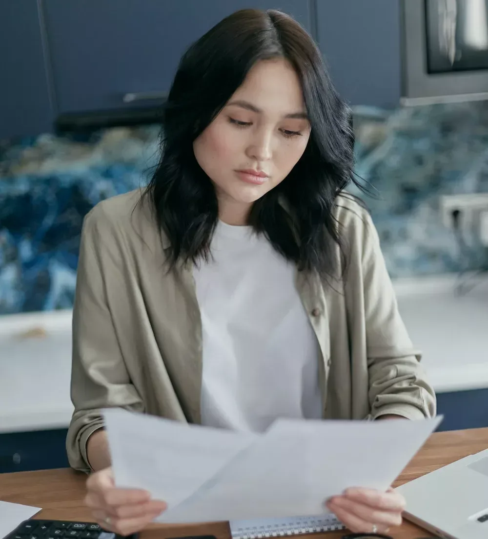 woman confused by paperwork