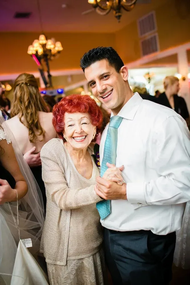 elderly mom and her son at a party